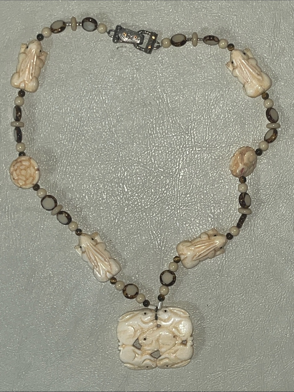 Carved Cream Bone Animal Motif Pendant Necklace with Beaded Accents